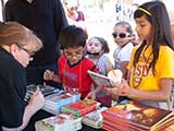 Debb helps the kids choose books. © Denise Gary