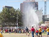 Our booth was temporarily deserted when the fire department turned on the water spray. © Denise Gary