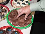 A hand raids the Brienholt cookies! © Robert Gary