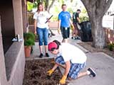 SARRC staffers Erica and Halley assist with the gardening project. © Robert Gary