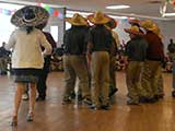 Kids Need to Read was invited to attend a special Cinco de Mayo celebration at the school. Here, some of the students participate in the dancing. © Denise Gary