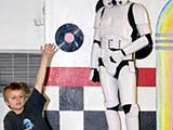 A student eagerly raised his hand under the vigilance of Stormtrooper TK-2035. © Denise Gary