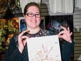 April Grady-Reyna of Reyna Art displays her contribution to the upcoming Phoenix Comicon Charity Art Auction, benefiting KNTR. © Denise Gary