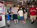Kids and adults swarmed the free comic book table. © Denise Gary
