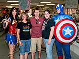 Wonder Woman and Captain America watch over Denise, Phoenix Comicon Director Matt Solberg, and Phoenix Comicon Marketing Director Jillian Stark Squires. © Denise Gary