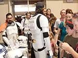 Stormtroopers and Mando Mercs help with the Star Wars Smuggler's Run and Bounty Hunt games benefiting KNTR. © Bruce Matsunaga