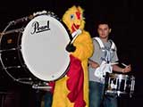 Entertainment included martial arts demonstrations, dancers, bands, and this drumstick wielding chicken! © Denise Gary