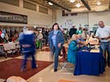 The gymnasium at Higley High School filled up with folks enjoying the activities and information tables. © Denise Gary
