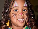 Facepainters brightened up the faces of the kids with whimsical artistry. © Denise Gary